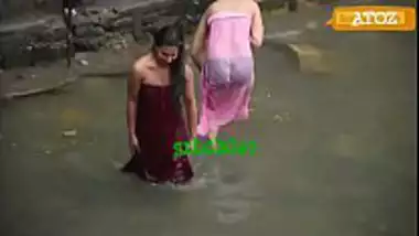 Indian village girls having a public bath