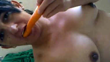 Hot Young Teen girl using carrot for her pleasure purpose