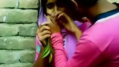 Young couple enjoy outdoor kiss and foreplay infront of friend