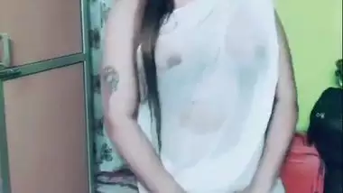 Desi girl in transparent sari dances and sings in short TikTok video