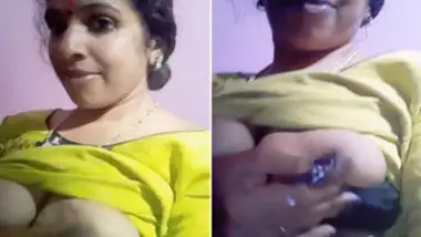 Attractive Indian teen gladly plays with her XXX boobs and nipples
