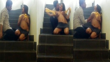 Horny booby girl sex on staircase captured on cam