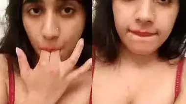 Desi in a XXX red bra flashes her sex pussy and masturbates it on camera