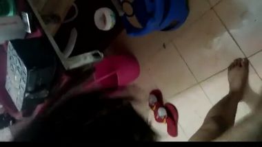 Boyfriend lies on the floor to receive handjob by Desi girl in porn video
