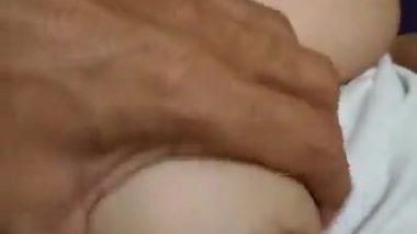 Guy can't resist Indian aunty's naked titties and greedily paws them