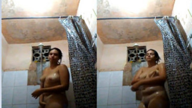 Nude Indian woman relaxes solo in the shower in amateur porn clip