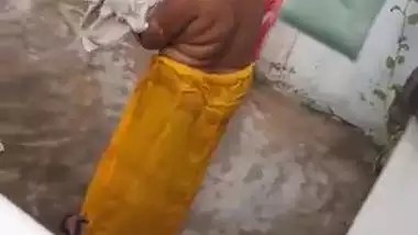 MILF dries hair and body outdoors being filmed by an Indian perv