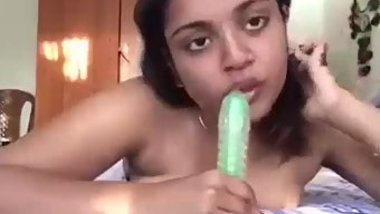 Solo chudai video of young Indian angel carefully sucking XXX dildo