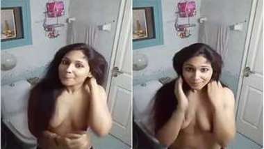 Desi girl tip her hand looking into camera showing XXX boobs off