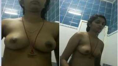 Off-color woman from India filmed on camera putting clothes on XXX body