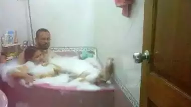 Aged couple have a fun a romantic baths in their bathtub