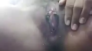 Horny teen Desi girl fingering naked pussy