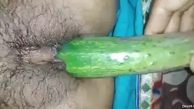 Aroused male XXX sticks cucumber into Desi wife's pussy before sex