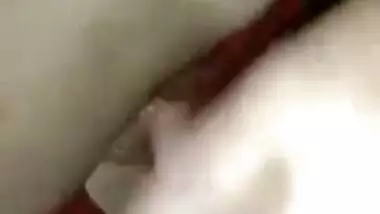Wife lies on the bed letting the Desi hubby film the porn video