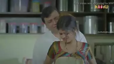 Indian girl by old man in kitchen