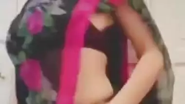 Woman in sari perform XXX dance and slowly strips down moving body