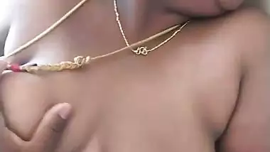 Stepson squeezes his stepmom’s big boob in nude MMS