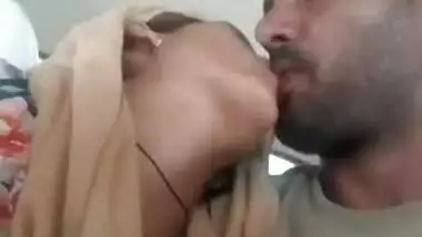 Bearded lad kisses Indian girlfriend's nipple in the backseat