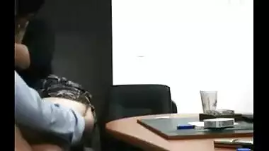 Hidden cam catches a mature slut enjoying office sex