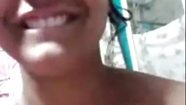 Smiling beautiful girl topless on video call