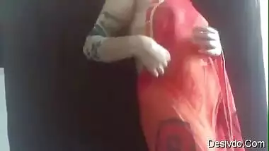 Hot & Sexy desi wife Simran Bhabhi showing boobs and ass in Red saree
