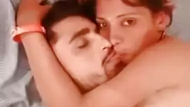 Indian couple lie next to each other and expose private body parts