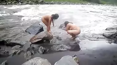 Two fat Desi women show their XXX assets while relaxing naked in river