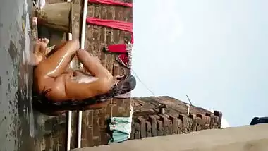 Chubby Indian wife bathing nude on open rooftop