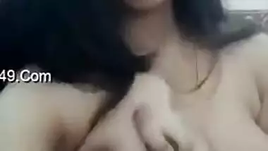 Indian whore lays bare XXX boobs with dark nipples squeezing them