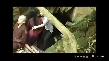 Buddhist monk doing tantric sex in outdoor cave