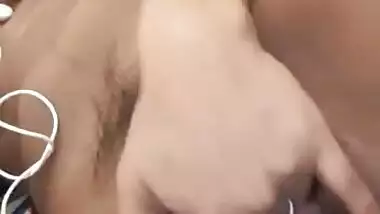 Naughty teen girl fingering her hairy pussy