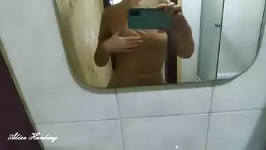 Alice takes a selfie and shows her tits and pussy in the shower room